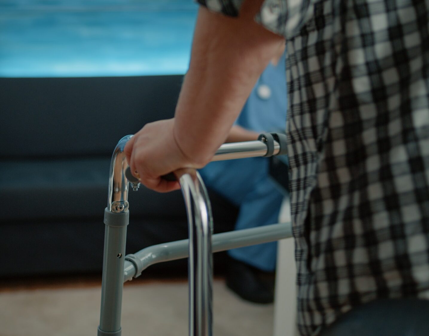 Close up of disabled patient having hand on walk frame